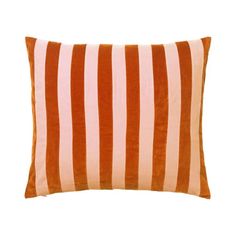 an orange and white striped pillow on a white background