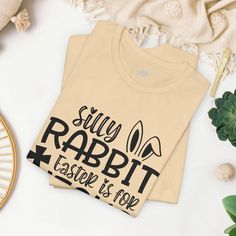 "Easter Christian T-shirt Hop into the Easter season with our "Silly Rabbit Easter is for Jesus" Shirt! This playful and festive design captures the joy and spirit of Easter while celebrating the true meaning behind the holiday. Key Features: Whimsical Design: Our shirt features a charming and lighthearted design with the phrase "Silly Rabbit Easter is for Jesus" printed in white font. It's sure to bring smiles and laughter to everyone who sees it. Premium Quality: Crafted from high-quality mate Silly Rabbit, Easter Shirts, Jesus Prints, Rabbit Easter, Easter Season, Jesus Shirt, Christian T Shirt, Whimsical Design, Festive Design