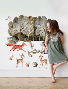 Transform any room into a whimsical woodland adventure with our Watercolor Forest Animals Stickers! These peel and stick, repositionable stickers will add a touch of playful charm to any space. Made with watercolor designs, these stickers are perfect for kids who love nature and imagination. DETAIL Made of the highest quality peel and stick fabric. The adhesive will not damage the wall. The peel and stick fabric can be applied to a lightly textured wall. Made in the USA. SIZE Item No: PS10005 Print Size: 24"w x 27"h or 24”w x 50”h ** The overall decal size will change wherever you apply it to the wall. Origin: USA Nature, Woodland Adventure, Nature Decal, Animals Stickers, Forest Mural, Chalkboard Decal, Whimsical Woodland, Watercolor Forest, Watercolor Designs