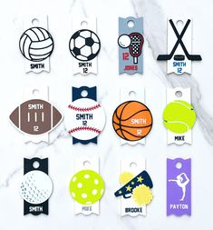 various sports themed luggage tags on a marble surface