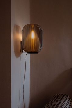 a lamp that is on the side of a wall