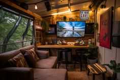 a living room filled with furniture and a flat screen tv mounted to the side of a wall