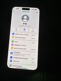 an iphone with the home button highlighted on it's back side, lit up in the dark