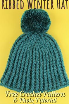 a knitted hat with a pom - pom on top