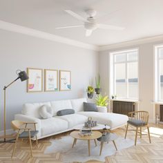 a living room filled with furniture and a ceiling fan in the middle of the room