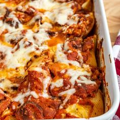 a casserole dish filled with meat and cheese