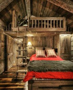 a bed in a room with wooden walls and ceilings, made from wood planks