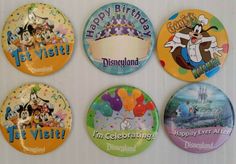 four mickey mouse magnets are shown on a refrigerator door with the words happy birthday, disneyland, i'm celebrating disneyland and disneyland