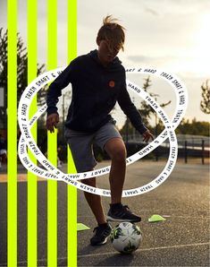 a young man kicking a soccer ball on top of a basketball court in front of a green and yellow striped background