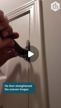 a person is opening a door with a pair of pliers in their left hand