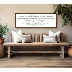 a wooden bench sitting in front of a wall with a quote above it that says, i choose you and if those you are over and over and over