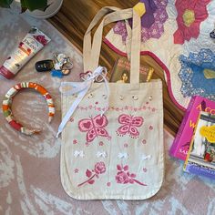 Cutie pink themed tote bag Handpainted by me :) fabric paint! 3D tiny pink roses and white bows! Used strong fabric glue to apply but refrain from washing as much as possible/hand wash gently. White adjustable bow on handbag that has a pink silver keychain and tiny white bunny charm on it!! ️🫖 Super strong and thick canvas material with six pockets inside!! And LOTS of space, could fit any laptop!! Handmade Pink Canvas Bag For Daily Use, Pink Handmade Canvas Bag For Daily Use, Paint 3d, Pink Tote Bag, Silver Keychain, Pink Tote Bags, White Bunny, Fabric Glue, Pink Tote