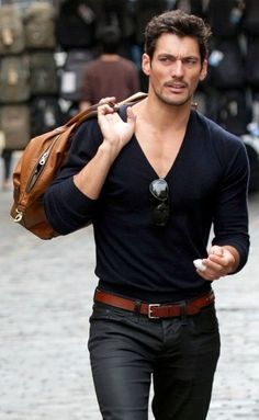 This deep V in a dark navy dressy sweater material is the perfect compliment to a fit man's body, esp a tall man, who wants to show off his confidence and sense of fashion. Adding this red brown belt to ad contrast to the all dark blues is sweet. Love this styling. Walking Down The Street, David James Gandy, Gq Style, David Gandy, Sharp Dressed Man, Well Dressed Men, Gentleman Style, Fashion Mode