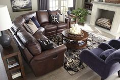 a living room filled with furniture and a fire place