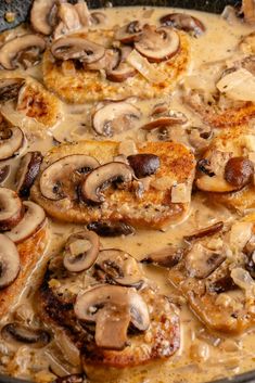 a skillet filled with meat covered in mushrooms