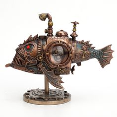 a steampunk fish clock is shown on top of a stand with red eyes