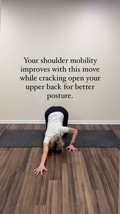 a woman is doing yoga in front of a wall that says, your shoulder mobility involves with this move while cracking open your upper back for better posture