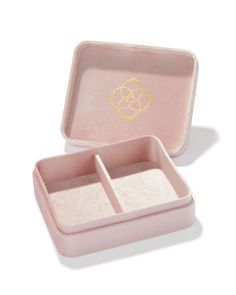 a pink box with two compartments on the inside and one in the middle, filled with sand