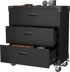 a black filing cabinet with three drawers and wheels on the bottom, one drawer is open