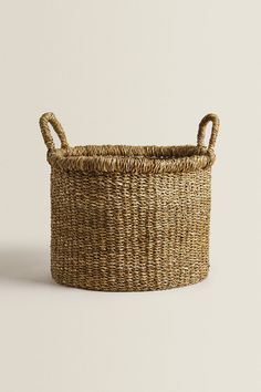 a woven basket with handles is shown