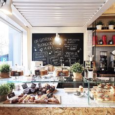 a coffee shop with lots of food on the counter