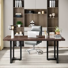 an office desk with a laptop on it and bookshelves in the back ground