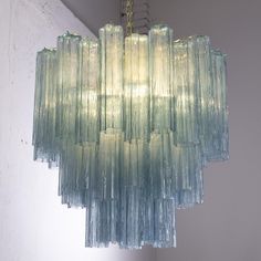 a chandelier hanging from the ceiling in a room