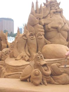 there is a sand sculpture that looks like it's made out of clay and has animals on it