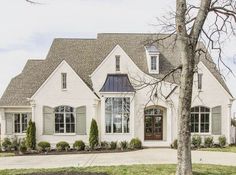 a large white house with lots of windows