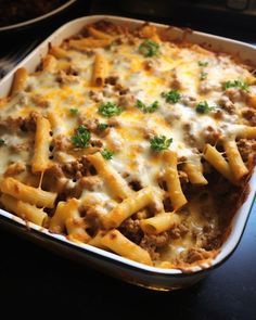 a casserole dish filled with meat and cheese