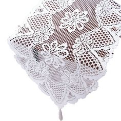 a white doily with brown dots on it