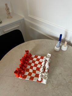 a chess board and pieces on a table