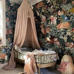 a canopy bed sitting next to a window in a room filled with flowers and birds