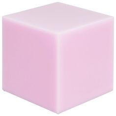 a pink cube sitting on top of a white surface