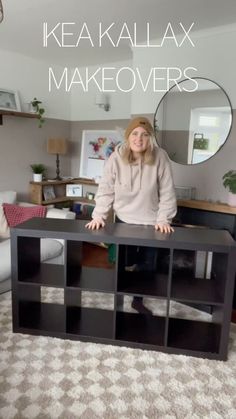 a woman standing in front of a black shelf with the words ikea kallax makeovers on it