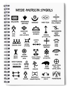 a spiral notebook with native american symbols written in black ink on the front and side