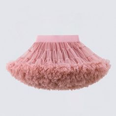 a pink skirt with ruffles hanging from it