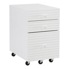 a white cabinet with three drawers sitting on top of it's casteor wheels