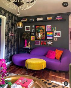 a living room with purple and yellow furniture