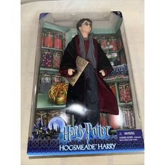 a toy harry potter figure is in the box