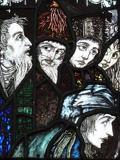 a stained glass window depicting three men and one is wearing a hat with feathers on it