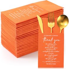 a stack of orange folded thank you cards with gold forks and spoons