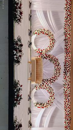 an overhead view of a wedding ceremony with flowers on the floor and white draping