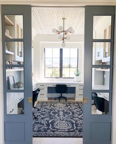 an instagram photo of a home office with two doors open to the living room