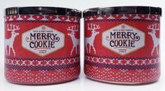 two red christmas cookie tins sitting next to each other