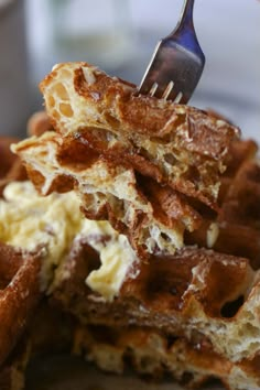 the waffles are being eaten with a fork