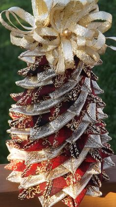 a christmas tree made out of ribbons on a table