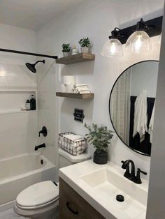 a bathroom with a toilet, sink and bathtub