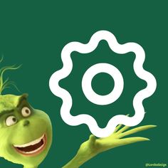 a green cartoon character holding up a white circular object