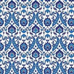 an intricate blue and white pattern with flowers on the bottom, in shades of blue